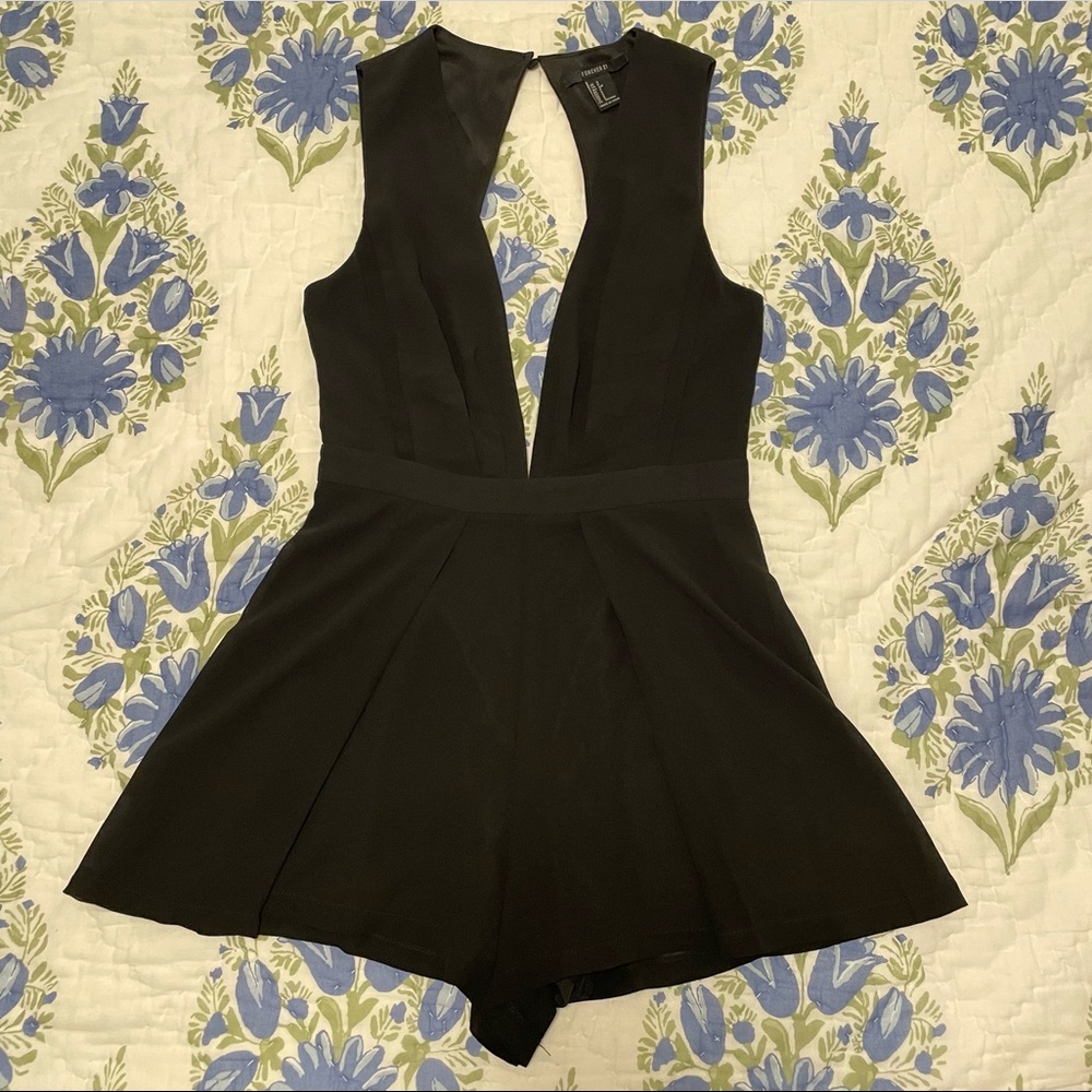 Black plunge neck romper. Size small.